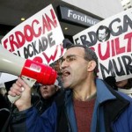 Kani Xulam of AKIN takes part in a Kurdish demonstration outside the American Enterprise Institute. (AP Photo/Matthew Cavanaugh)